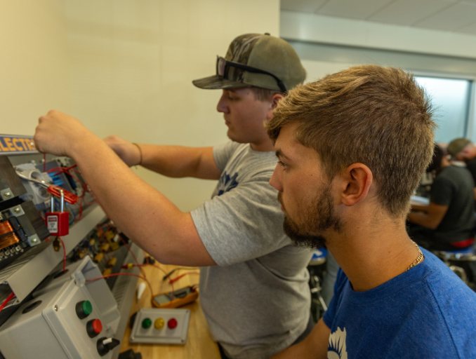 male students working in electrical lab