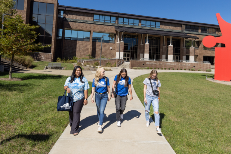 female students walking in courtyard