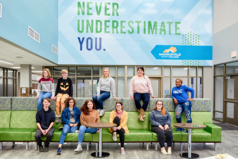 students sitting on furniture in student center