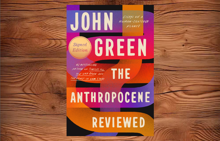 The book the Anthropocene Reviewed on a wood tabletop